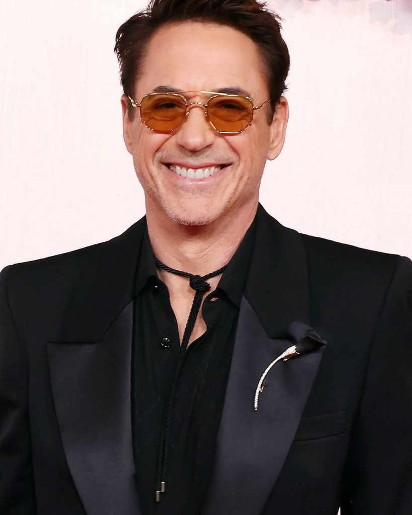 Robert Downey JR Oscars 2024 with Omega watch and Tiffany brooch