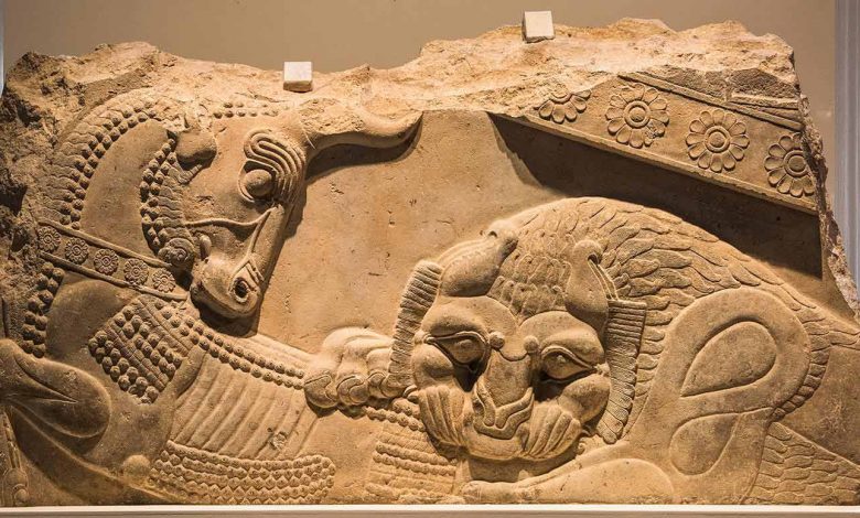 A relief of a lion and a cow from Persepolis, a symbol of fertility and the cycle of the year